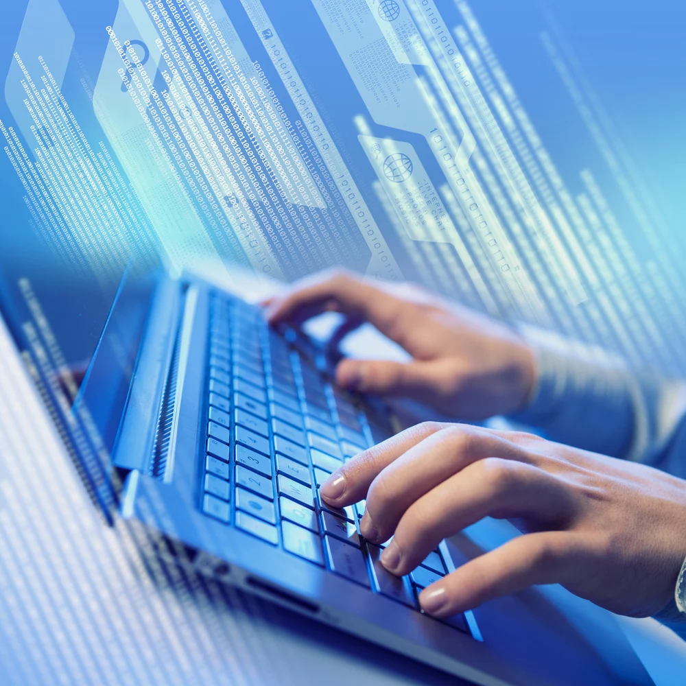 Hands of a young man on the keyboard with the elements
